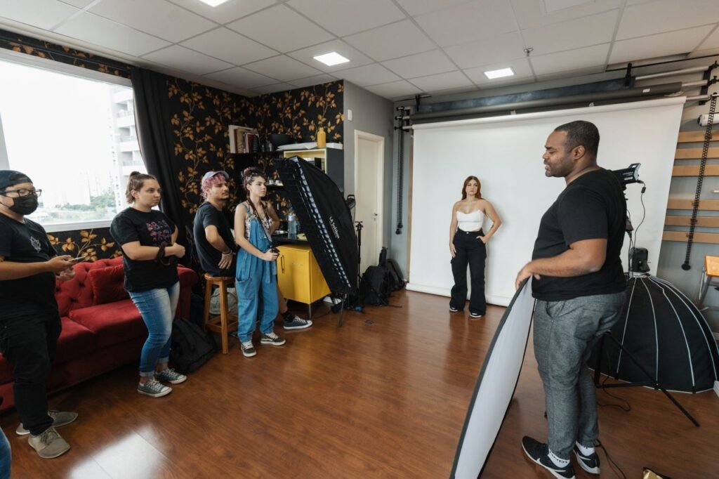 Group in a studio setting, focusing on photography techniques with professional equipment.