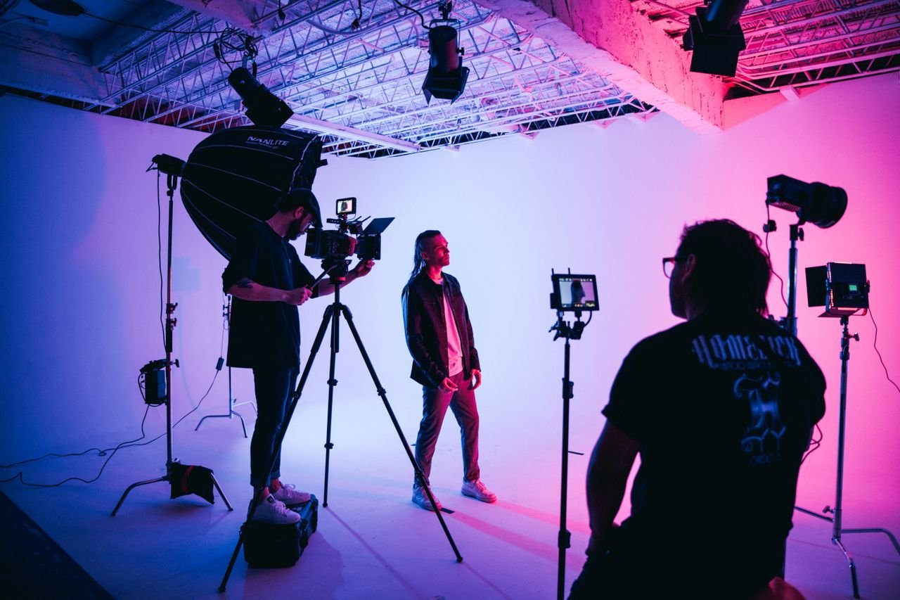 Camera crew shaping a story with professional lighting
